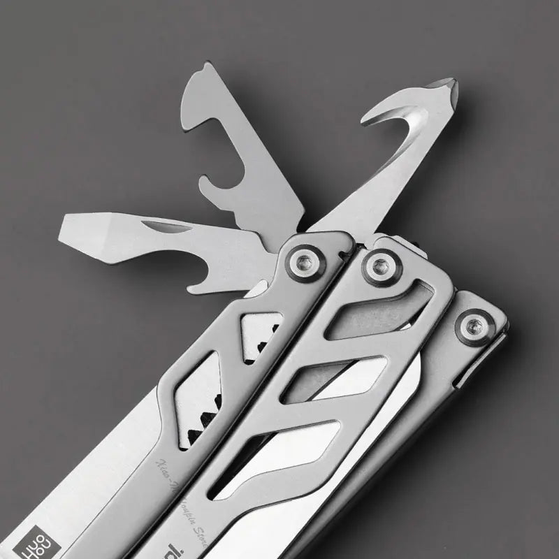Close-up of Xiaomi Mijia multifunctional folding knife showcasing its versatile tools and sleek design.