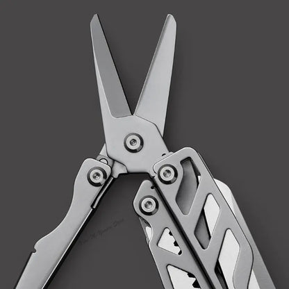 Close-up of the stainless steel blades of a multifunctional folding knife, highlighting its sleek design.